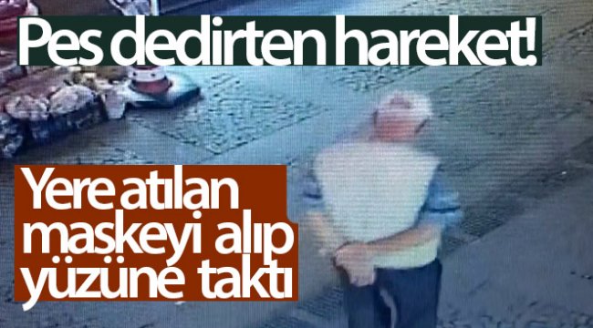 Yere atılan maskeyi alıp yüzüne taktı