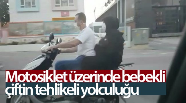 Motosiklet üzerinde bebekli çiftin tehlikeli yolculuğu